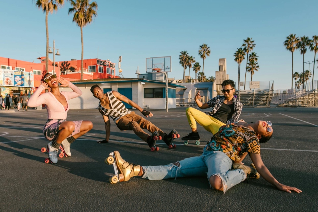 Gen Z roller skating on a beach sidewalk