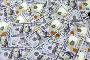 A pile of one hundred dollar bills