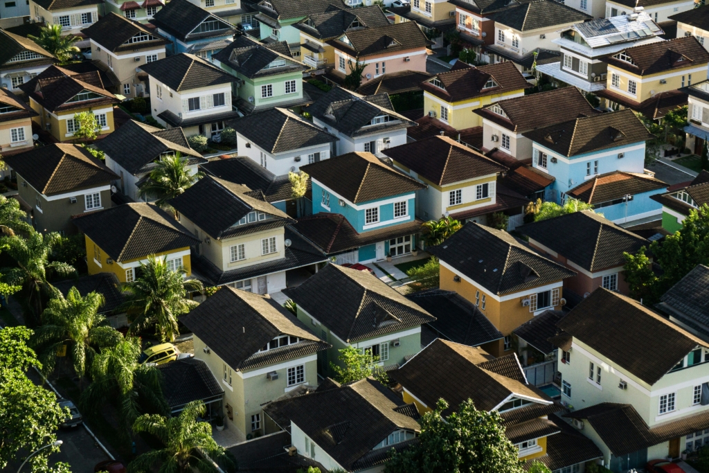An aerial view of a neighborhood of several houses with the same appearance