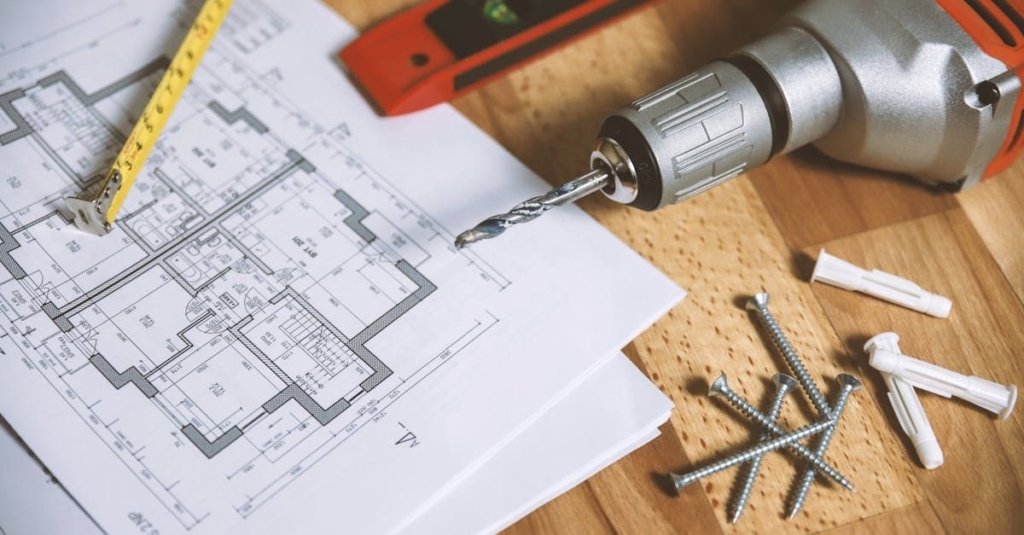 Some tools sitting on building plans.