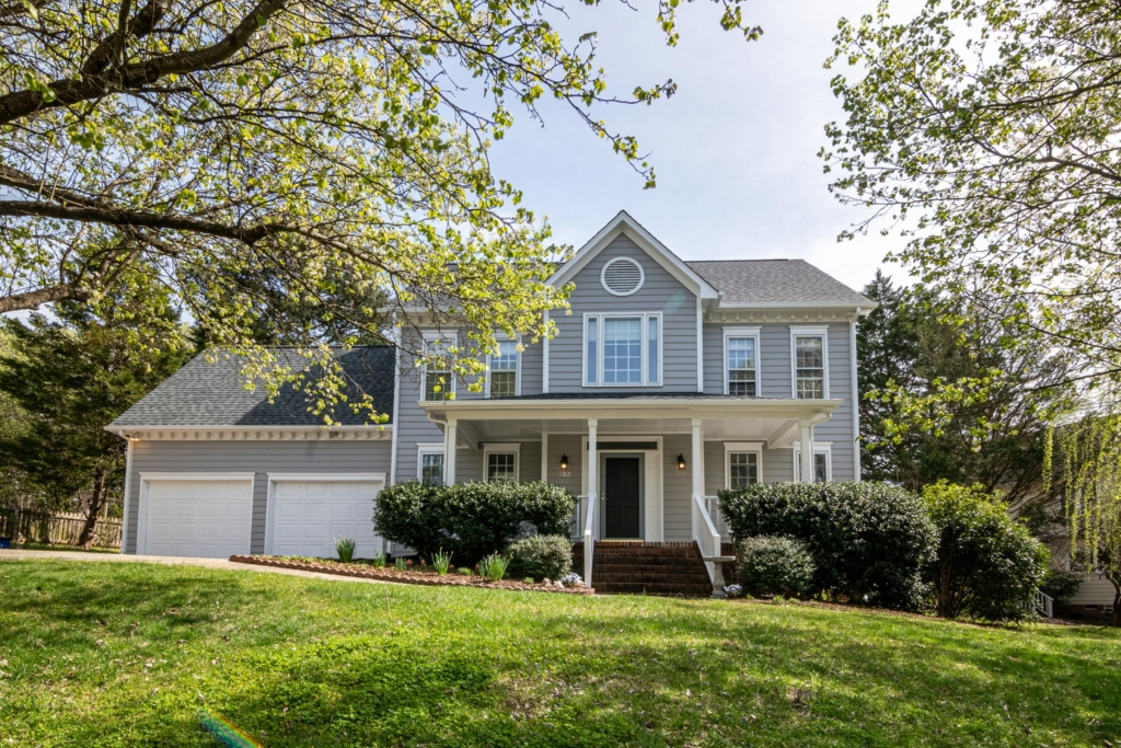 A beautiful home with a large front yard.