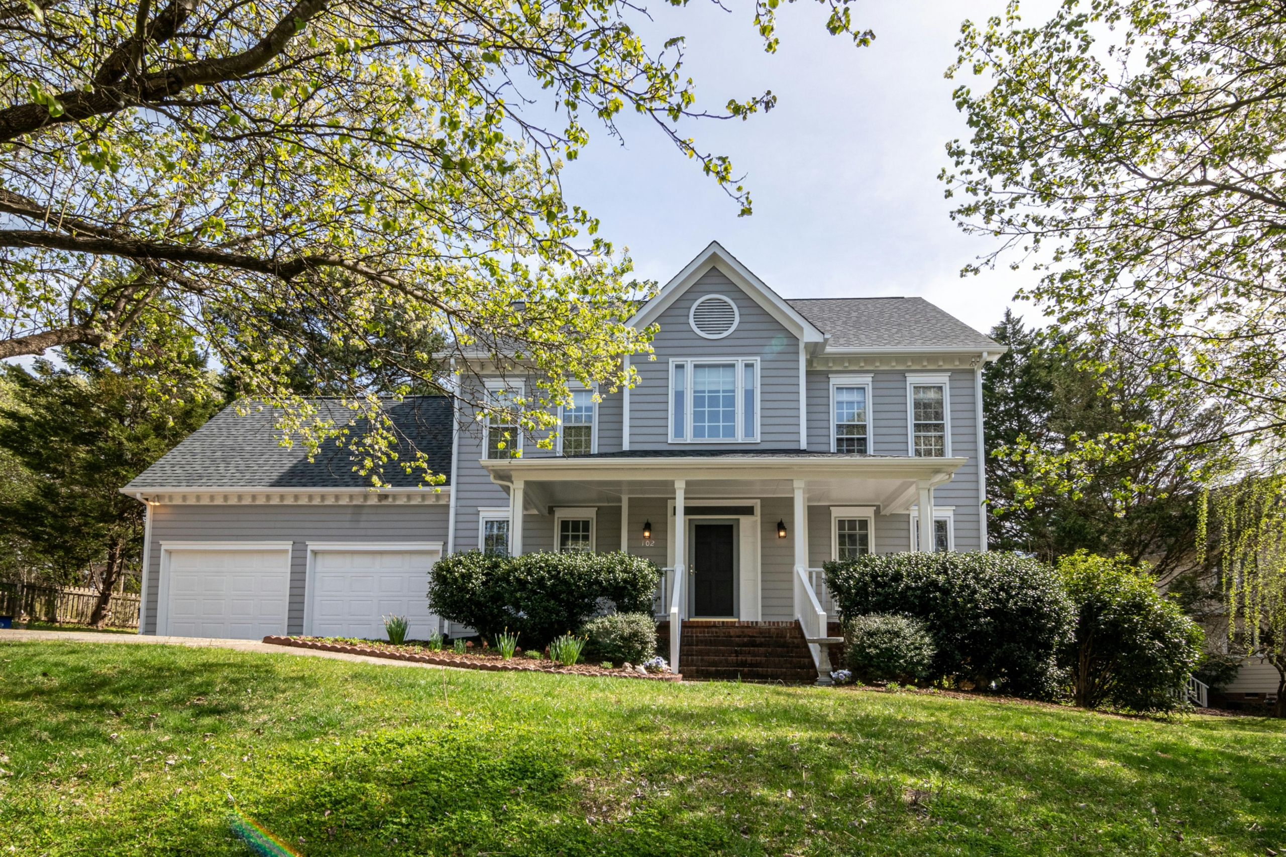 A beautiful home with a large front yard.