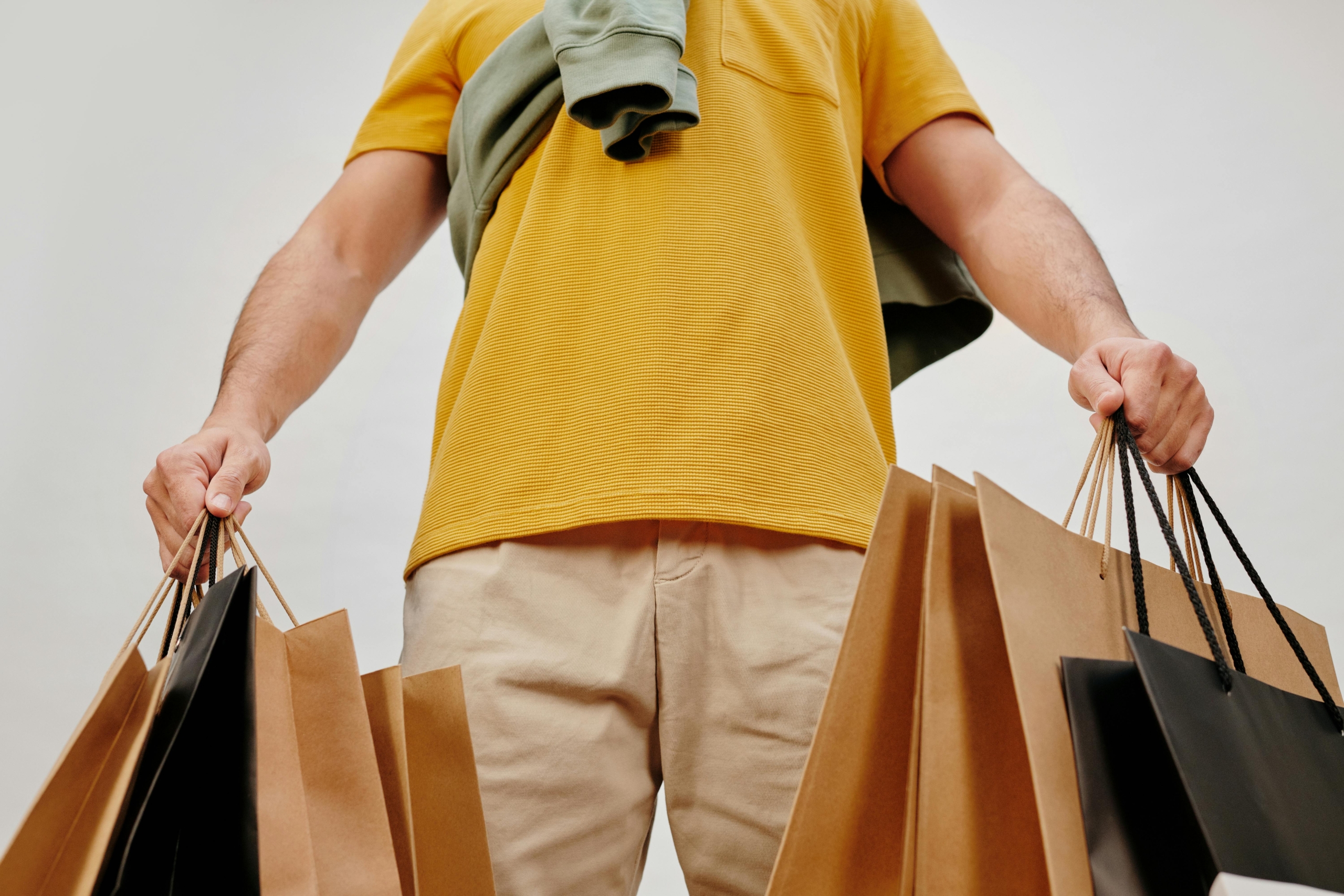 A man holding several shopping bags